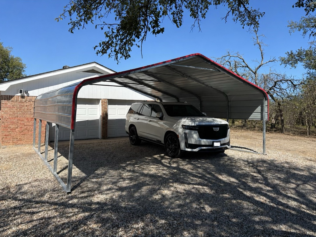 Finished metal carport with an SUV parked underneath